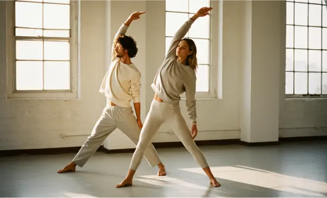 A man and woman doing yoga.